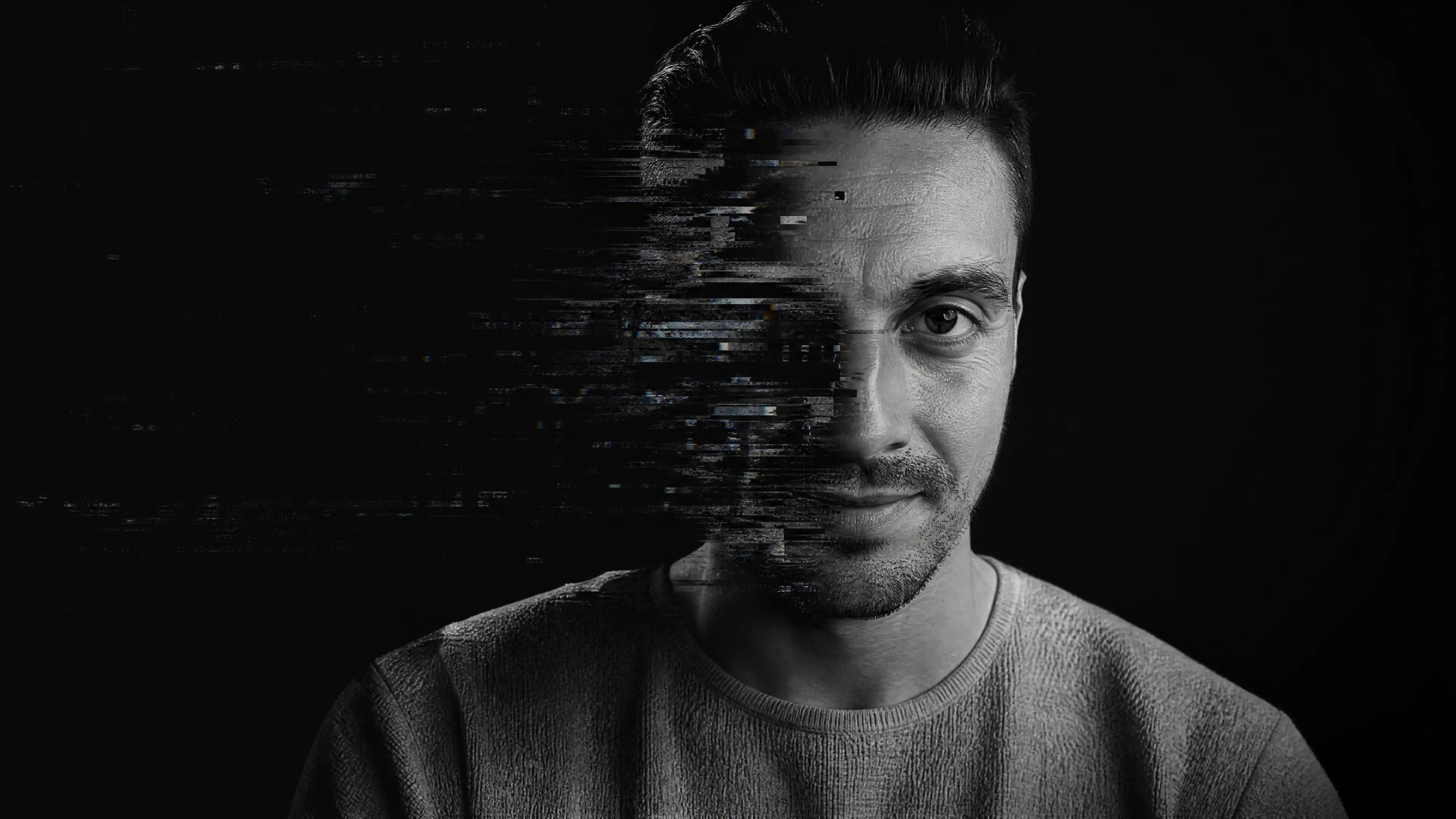 Nicolas Gorrono portrait dissolving into digital glitch